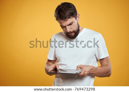  man looks at the tablet, technology, logo                              