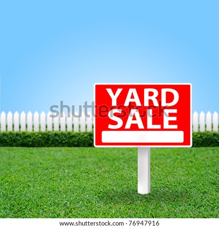 Yard Sale sign on grass field.
