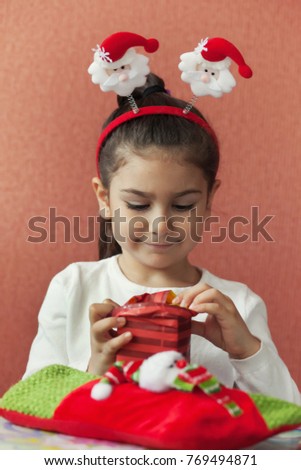 Holidays, presents, christmas, x-mas, birthday concept - happy child girl with gift box