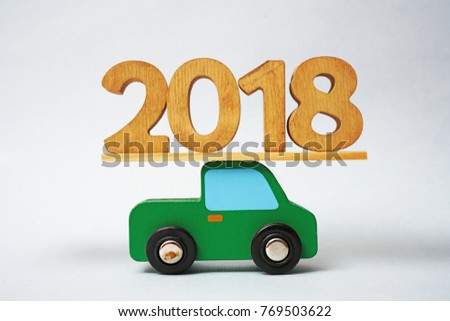 new Year 2018 of wood. Big wooden year number in wood of truck car. new years day, christmas, transportation, winter holiday, new years eve, trucking. green wooden car 