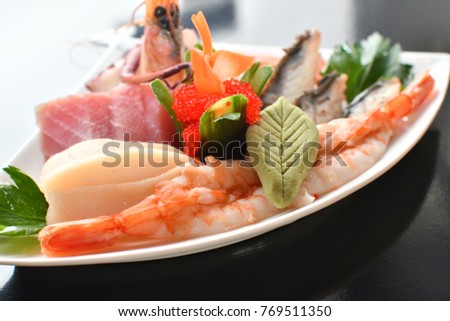 Sashimi suhi fresh , white plate, dark background