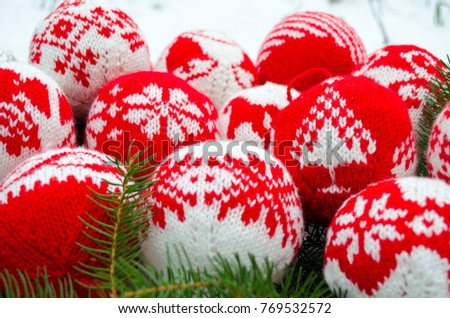 Knitted balls with ornament for new year tree decoration