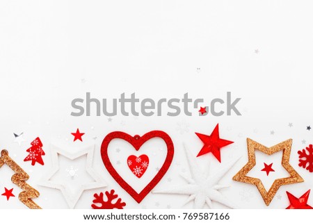 Christmas and New Year background with sparkling fir tree, heart, snowflakes and star confetti. Holiday symbols on white background with place for text.