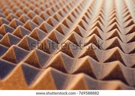 Closeup pattern of acoustic foam panel background, toned image