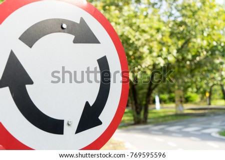 Roundabout crossroad, Circular junction road traffic sign for turn-abouts with Copy Space for Text.