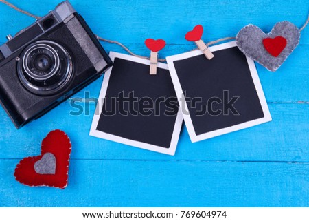 vintage camera on a turquoise wooden background valentine's day