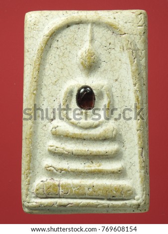 Thai amulets come in a wide variety of styles, shapes and sizes, and related to Buddhist, Sacred Thai Buddhist Amulets and Occult Charms, macro