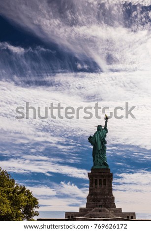 New York City, United States - August 23, 2017: Statue of Liberty under a cloudy sky.