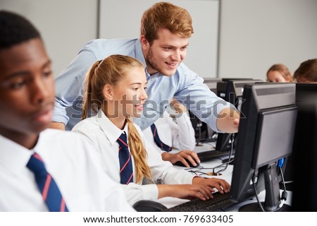 Teenage Students Wearing Uniform Studying In IT Class Royalty-Free Stock Photo #769633405