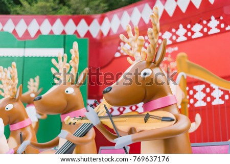 Christmas Santa's Reindeer with violin.