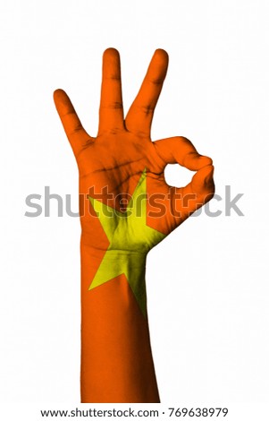 Hand making Ok sign, Vietnam flag painted as symbol of best quality, positivity and success - isolated on white background