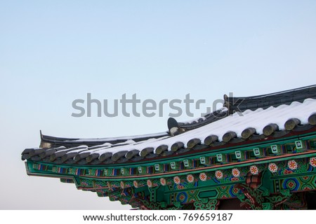 Korean temple roof covered in snow