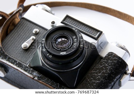 Old leather vintage camera on white background