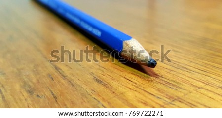 blue pencil in a desk