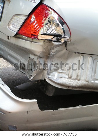 AUTOMOBILE ACCIDENT WITH SMASHED REAR BUMPER Royalty-Free Stock Photo #769735