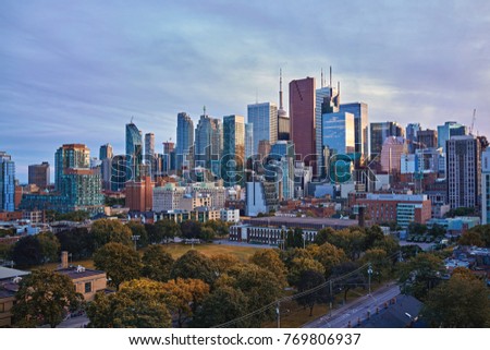 Toronto Skyline in autumn - Facades and rooftops of skyscrapers in the  Financial District of Toronto at sunset
