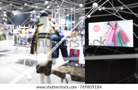 Intelligent Digital Signage in smart retail , Augmented reality marketing and face recognition concept. Interactive artificial intelligence digital advertisement in fashion retail shopping Mall.