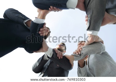 business team are taking each other's hands