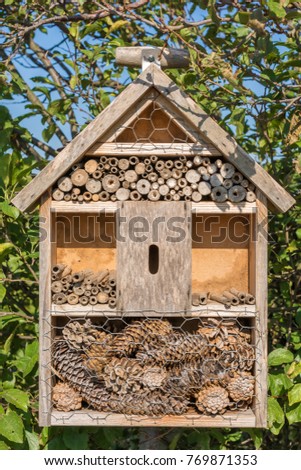 Crafted insect hotel for the settlement of beneficial insects in the garden