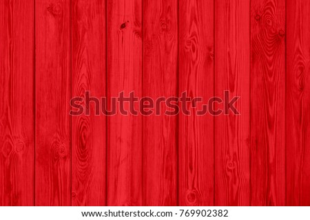 Red wood plank texture of pine grain with knots. Cool wooden background. Royalty-Free Stock Photo #769902382