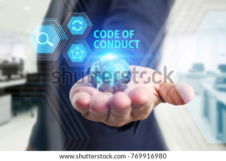 The concept of business, technology, the Internet and the network. A young entrepreneur working on a virtual screen of the future and sees the inscription: Code of conduct