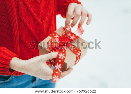 Women presents a Christmas box