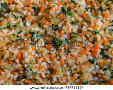 Vegetarian stuffing for dolma with rice, onions and carrots. Close-up.