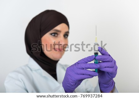 Doctor Muslim Islamic women on white background with injection
