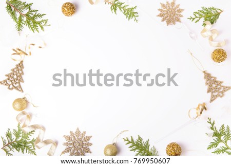 Christmas holiday composition. Festive creative golden pattern, xmas gold decor holiday ball with ribbon, snowflakes, christmas tree on white background. Flat lay, top view
