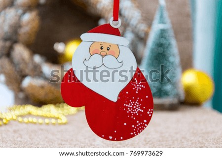 
Wooden Christmas decor with the image of Santa Claus