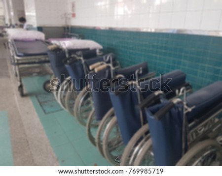 It's a blurred photo of wheel chairs and hospital beds that for emergency case at the hospital. Health care concept.