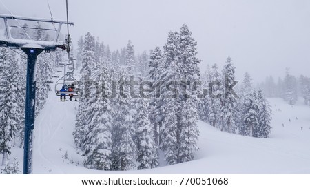 16x9, wide screen. Lift system at ski resort in California, Mammoth mountain. Fir trees covered by white snow - aerial view. Gorgeous winter scenes Royalty-Free Stock Photo #770051068