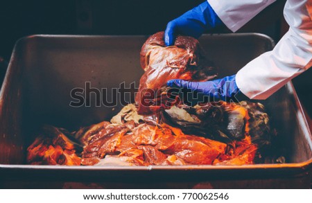 Man hand holding the raw meat