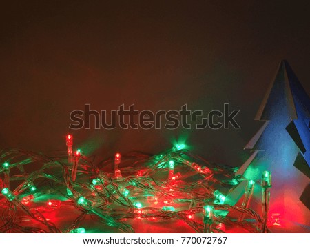 Abstract paper origami spruce Christmas star tree with snowflake, northern light and snow in winter, xmas and new year