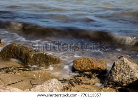 Sea waves splashing over rocks