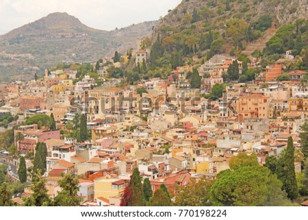 Beautiful Scenic View of Taormina's Old Town. Terracotta Old Ancient City Houses with Tiled Roofs. The island of Sicily, Italy.
