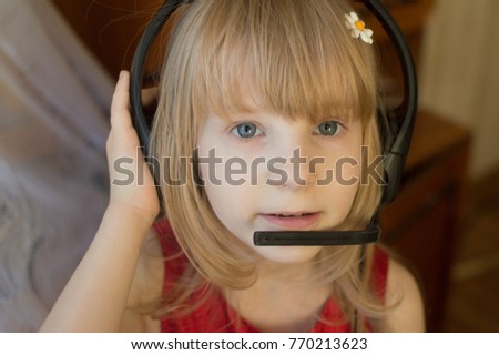 Little girl in headphones