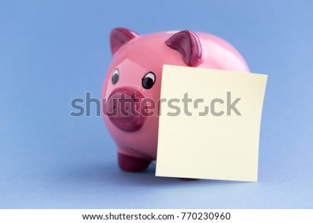 PIGGY BANK WITH POST IT CONCEPT