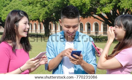 happy student use phone in the school