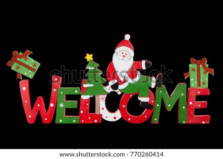 Christmas inscription welcome, isolated on a black background