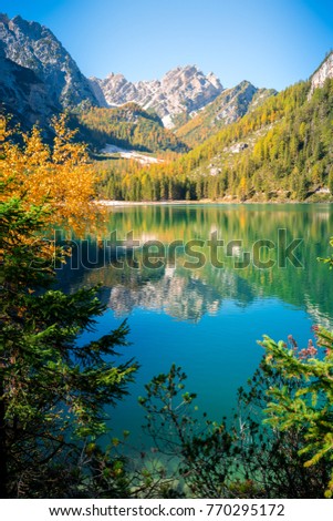 amazing view of braies lake with mountains and forest reflections on the water. northern italy, south tyrol