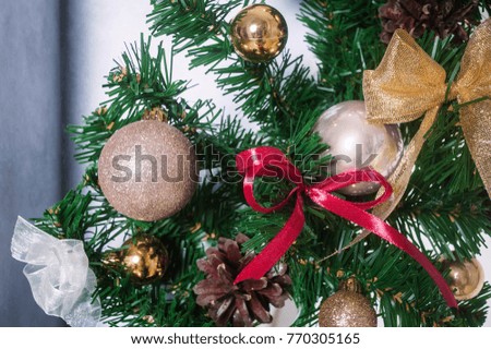 The big, beautifully decorated artificial Christmas fir tree. Christmas tree decorations. New Year's background