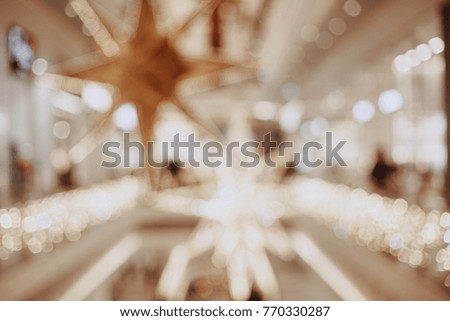 Blurred chrismas background with lights and big stars.