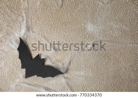 Paper bat as decor for Halloween party on wall