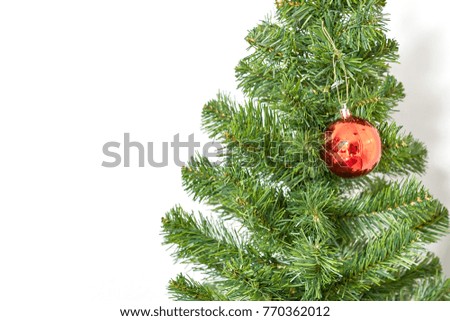Christmas ball on the green branch white background