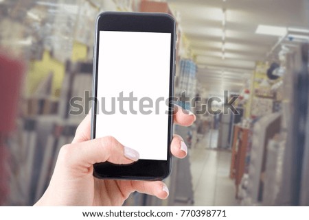 smartphone with a blank screen keeps the woman and shopping in the store