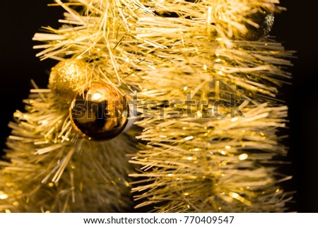 Christmas decoration with tinsel and reflective balls