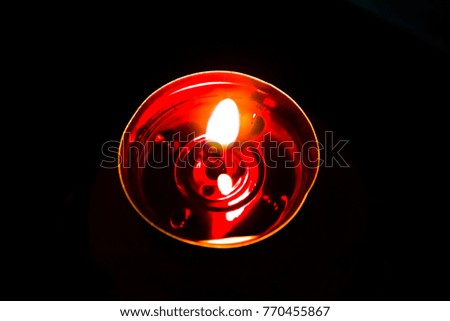 Abstract Candles red golden light burning at night