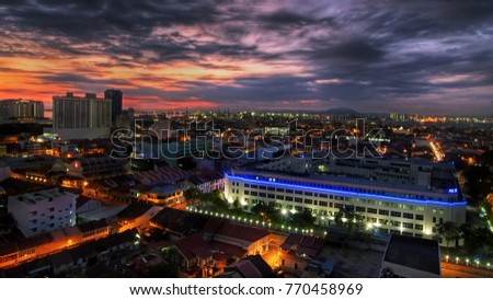 Georgetown, Penang - NOVEMBER 11th 2017 : Amazing view of downtown Georgetown from higher ground before sunrise with amazing blue light from Police Station and roads lights turning on. 