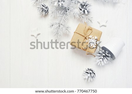 Mockup Christmas kraft gift and tree cone, flatlay on a white wooden background, with place for your text